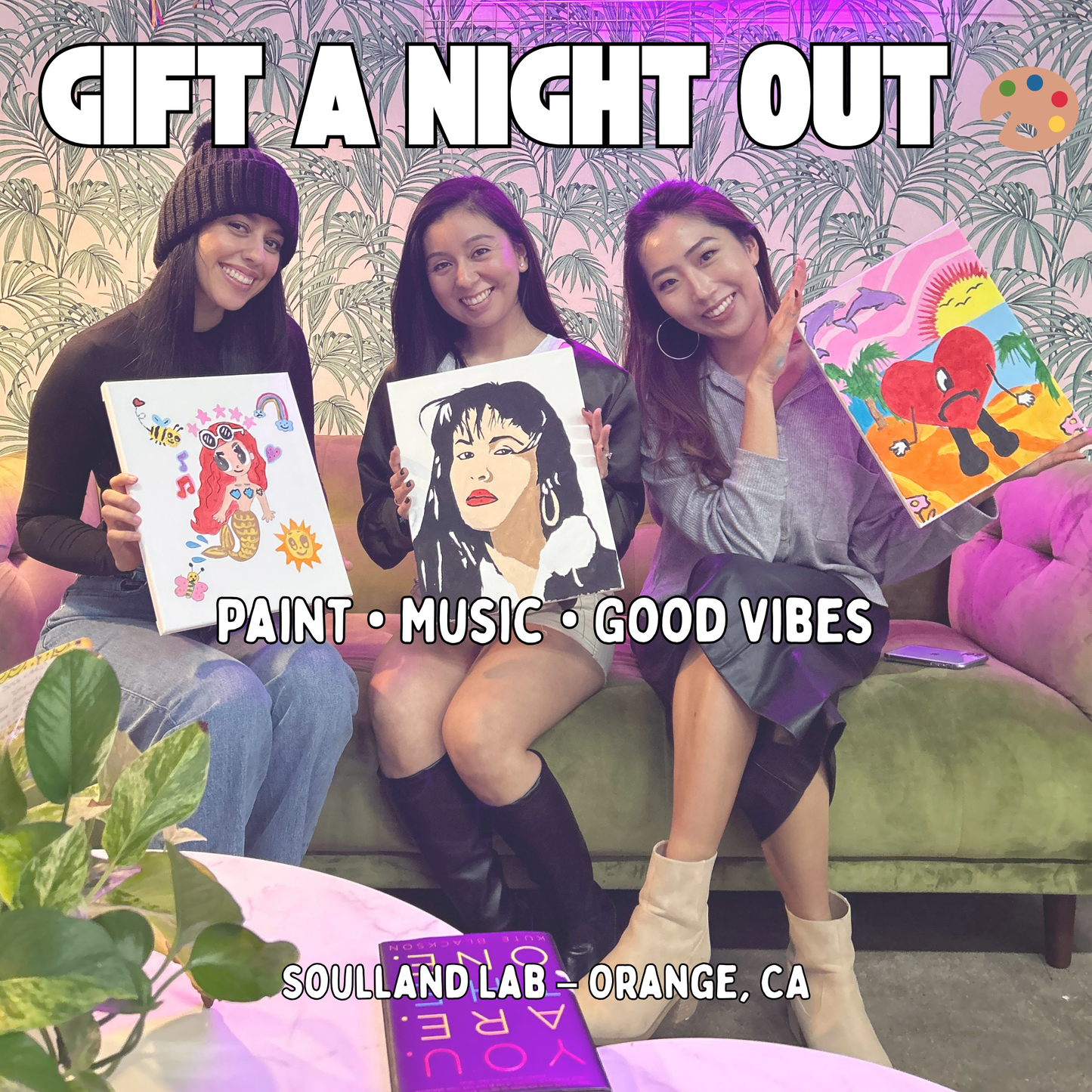 Friends smiling and holding paintings at Soulland Lab paint and sip studio in Orange, CA – creative gift card experience