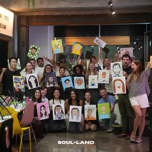 team building, group of people painted each other on canvas. super funny