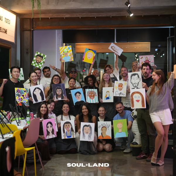 team building, group of people painted each other on canvas. super funny