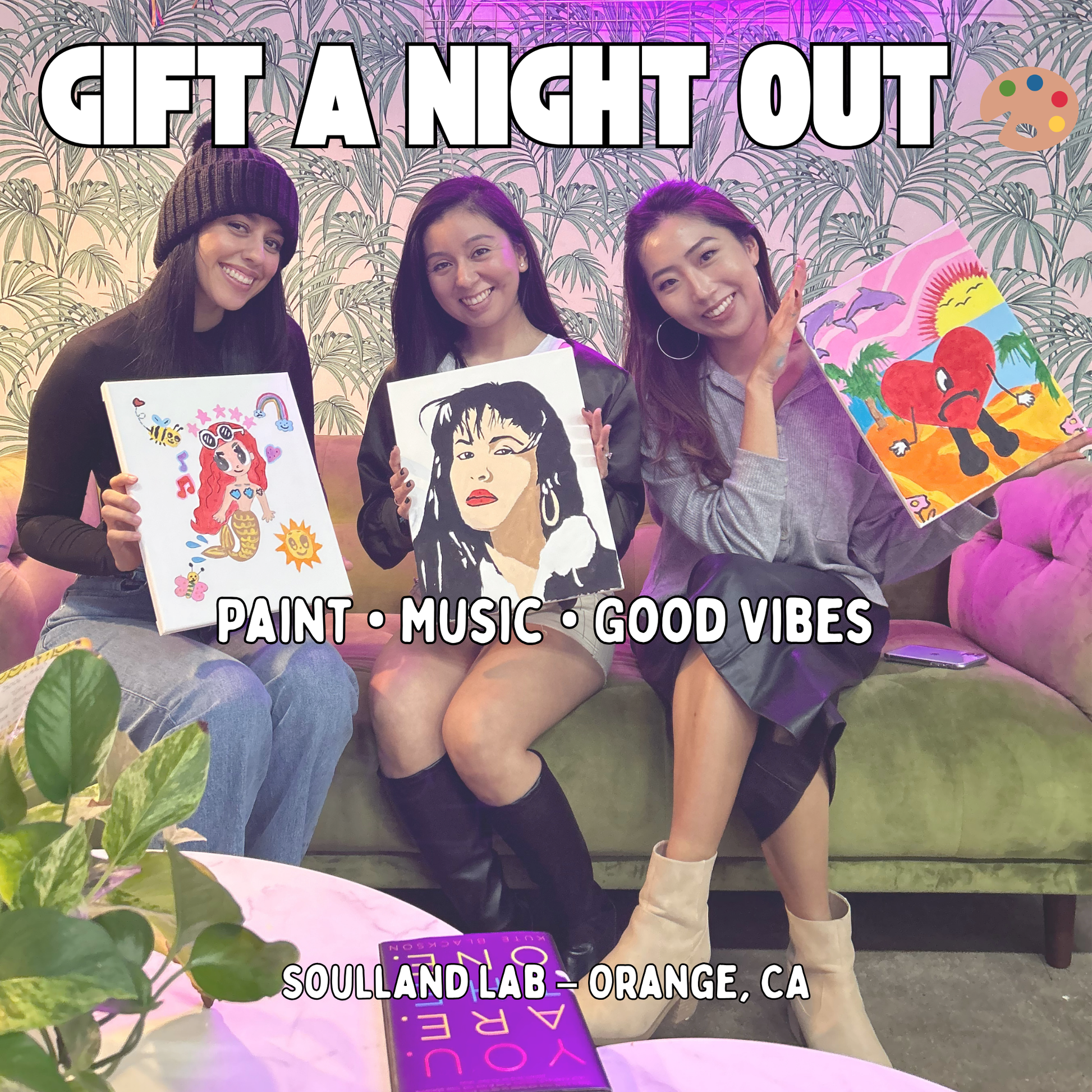 Friends smiling and holding paintings at Soulland Lab paint and sip studio in Orange, CA – creative gift card experience