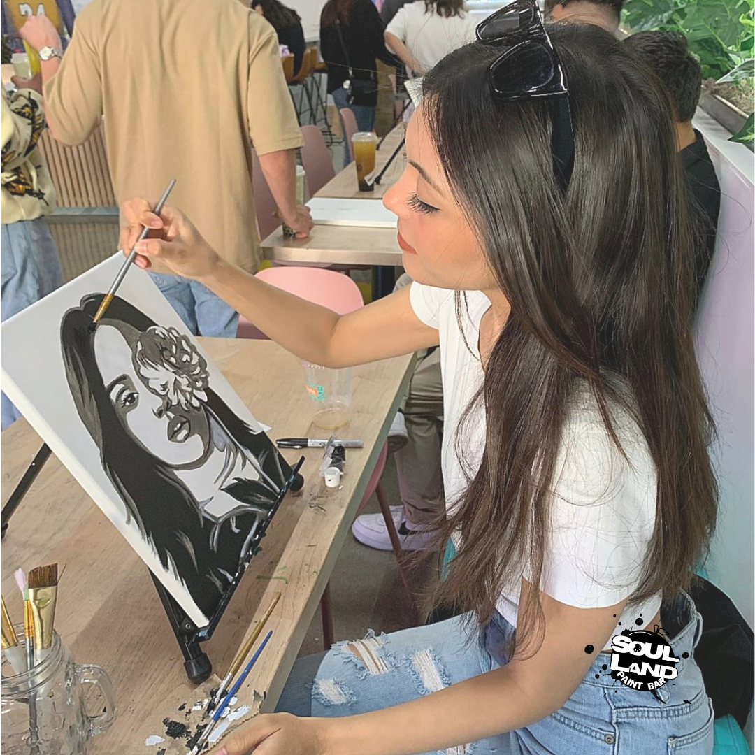 girl painting a blank canvas