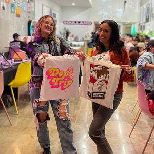 two ladies painting a cool tote