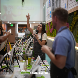 a lady from acorns team building at soulland lab talking to her team
